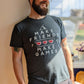 A t-shirt with the words "Make Friends Make Games," featuring 3 hearts like in a Zelda Game, and the MIghty Yell Mountain Logo, arranged aesthetically on the front of the shirt.  Charcoal grey shirt with white text and red hearts. 